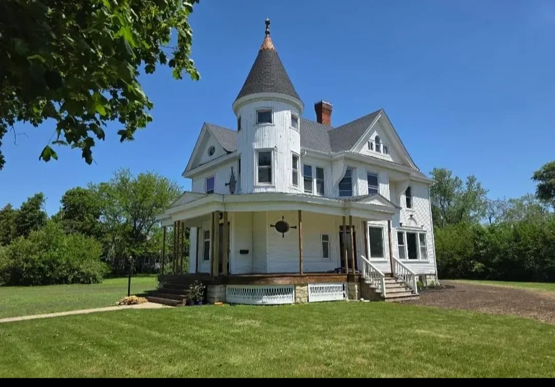 After severe storm damage in Chenoa, IL, this historic 1899 home received a complete exterior upgrade—including a new roof, siding, window wraps, soffit, fascia, and seamless gutters. Proudly restored by Nailed It Home Solutions.